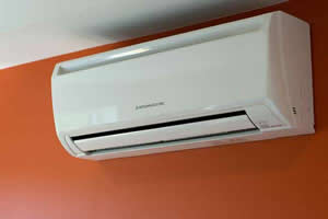 Mitsubishi ductless unit mounted on wall — SMS installation